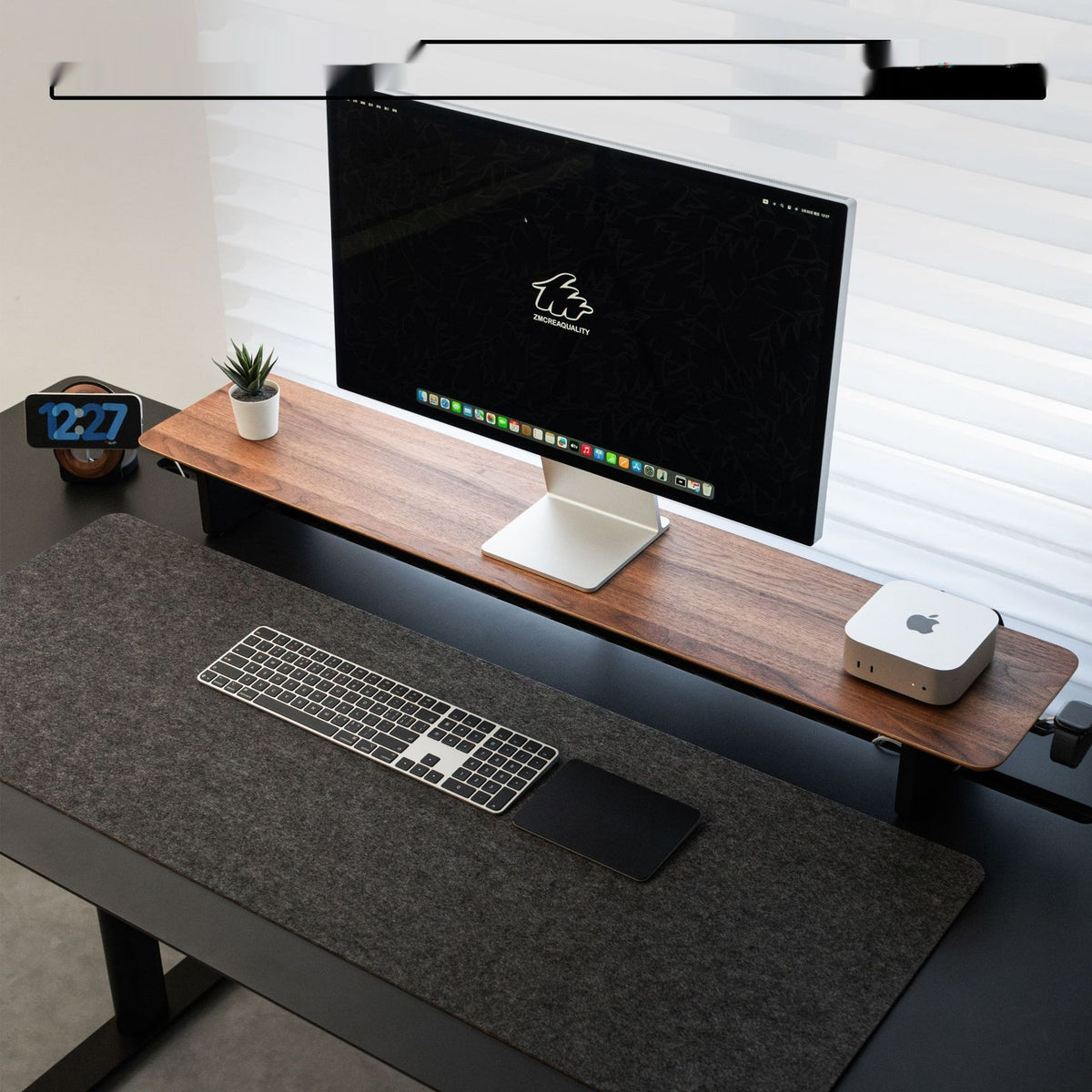 Wide Walnut Monitor Riser under a desktop monitor