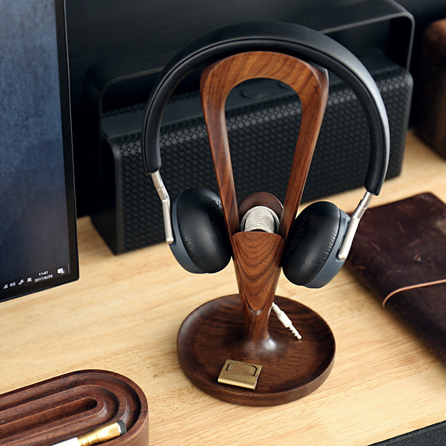 Solid Wood Headphone Stand with headphones on a desk