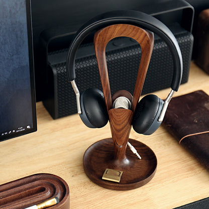 Solid Wood Headphone Stand with headphones on a desk